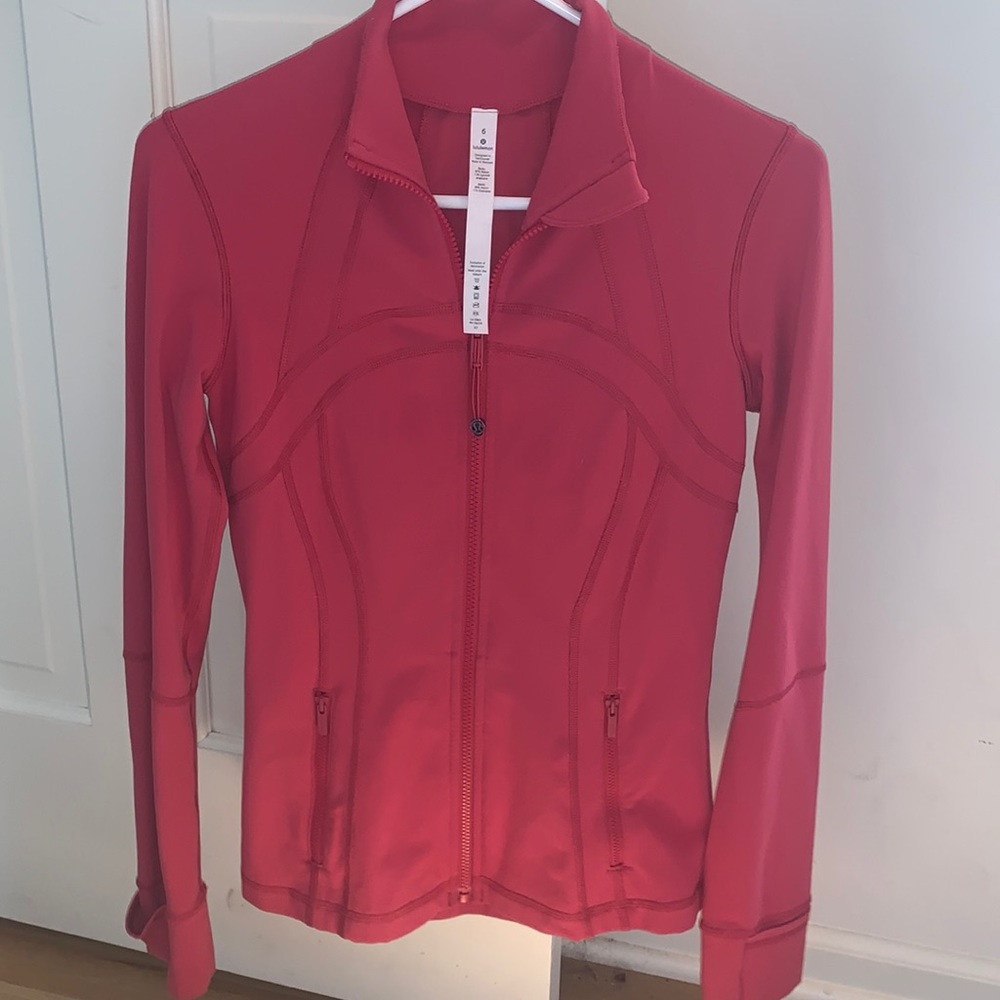 Never worn  pink Lulu lemon zip up jacket size 6